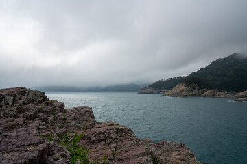 Cloudy Sea and Rocky Cliffs of an Island