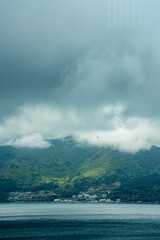 A Village Nestled by the Cldudy Mountains and the Seaside