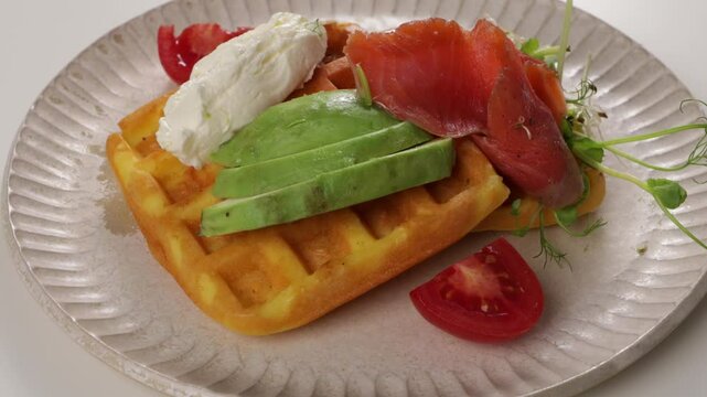 breakfast waffles with cheese and red fish slice on plate zoon food