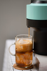 Capsule coffee machine with espresso cup. Nespresso is worldwide leader company with coffee