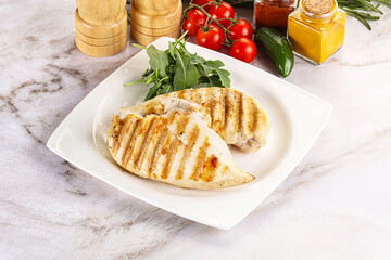 Grilled chicken breast served arugula