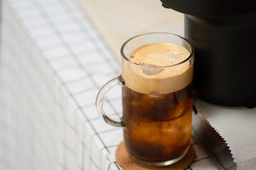 Capsule coffee machine with espresso cup. Nespresso is worldwide leader company with coffee