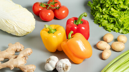 Assortment of bell pepper, cabbage, garlic, lettuce, tomatoes, garlic, potatoes