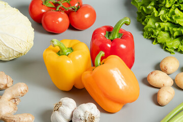 Assortment of bell pepper, cabbage, garlic, lettuce, tomatoes, garlic, potatoes