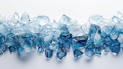 Close-up of a pile of blue tinted ice cubes on a white background.