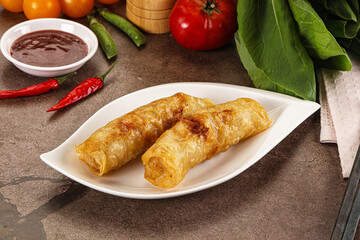 Vietnamese stuffed spring roll served sauce