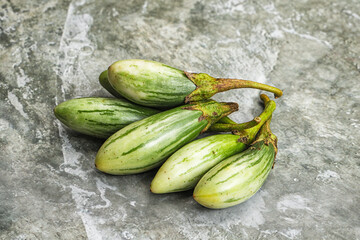 Small organic young green eggplant