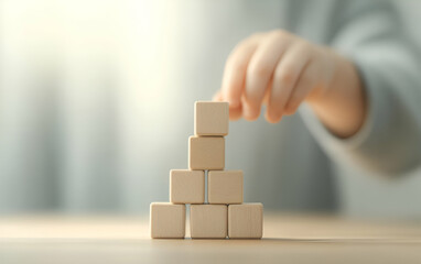 A child carefully stacking wooden blocks, fostering creativity and fine motor skills in a playful environment.