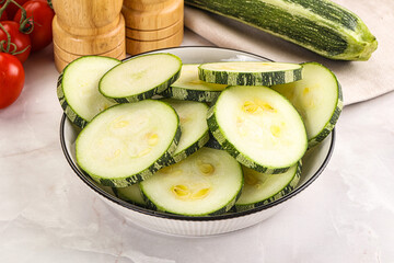 Raw green zucchini slices for cooking