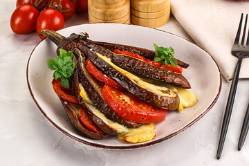 Baked tomato with mozzarella and tomato