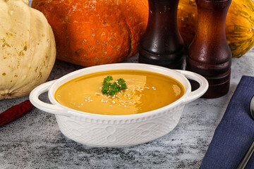 Vegan pumpkin cream soup served sesam