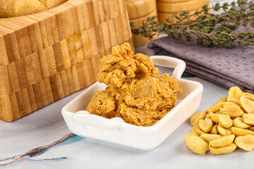 Crunchy peanut butter fat product