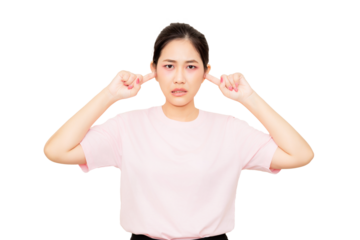 A woman is covering her ears with a distressed expression, conveying discomfort or frustration.