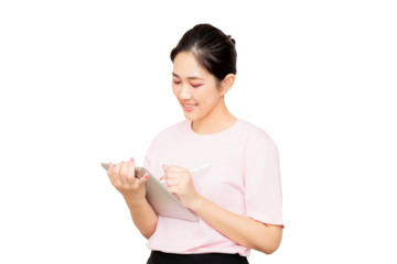 A smiling woman in a pink shirt using a tablet with a stylus, appearing engaged and focused on her task.