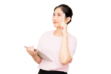 A thoughtful woman in a pink shirt holds a tablet, with one finger raised as if having an idea or realization.