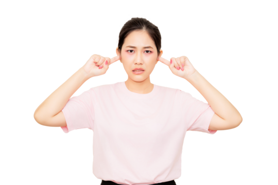 A woman is covering her ears with a distressed expression, conveying discomfort or frustration.