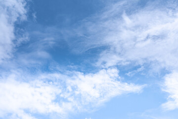 The sky is a vibrant, cloudless blue, while the sun shines brightly, making it appear even more radiant.