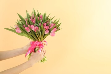 Woman with bouquet of beautiful tulips on beige background, closeup. Space for text