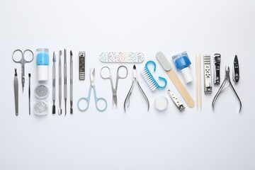 Set of different manicure tools on white background, flat lay