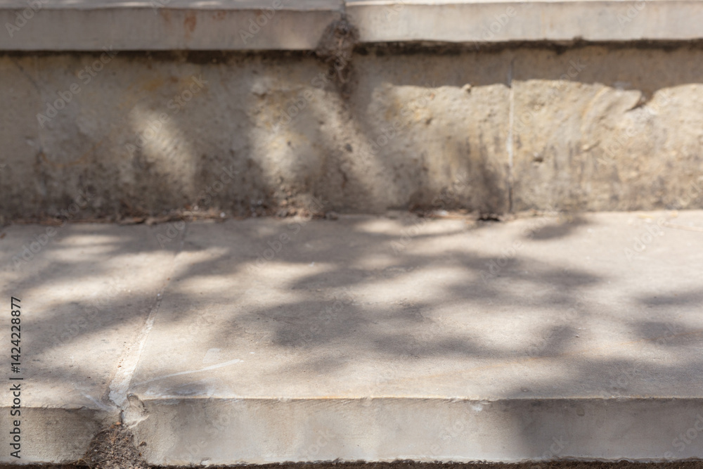 Aufkleber leaves and trees shadows in sunny day with sunlight on stone concrete surface podium table step mock up. Sunlight shadows highlights display design abstract empty place shelf and tabletop