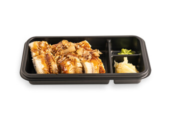 Set of six juicy traditional asian sushi rolls or maki made from boiled rice, seaweed, fresh eel fish packed with ginger and wasabi in black plastic delivery box or container isolated on white