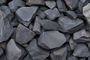 Dark gray stones tightly packed together