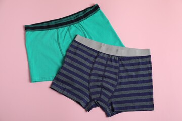 Comfortable men's underwear on pink background, flat lay