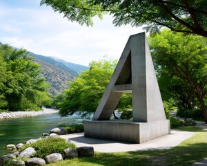Fototapeta premium Monument Aligned with River Surrounded by Lush Rural Landscape