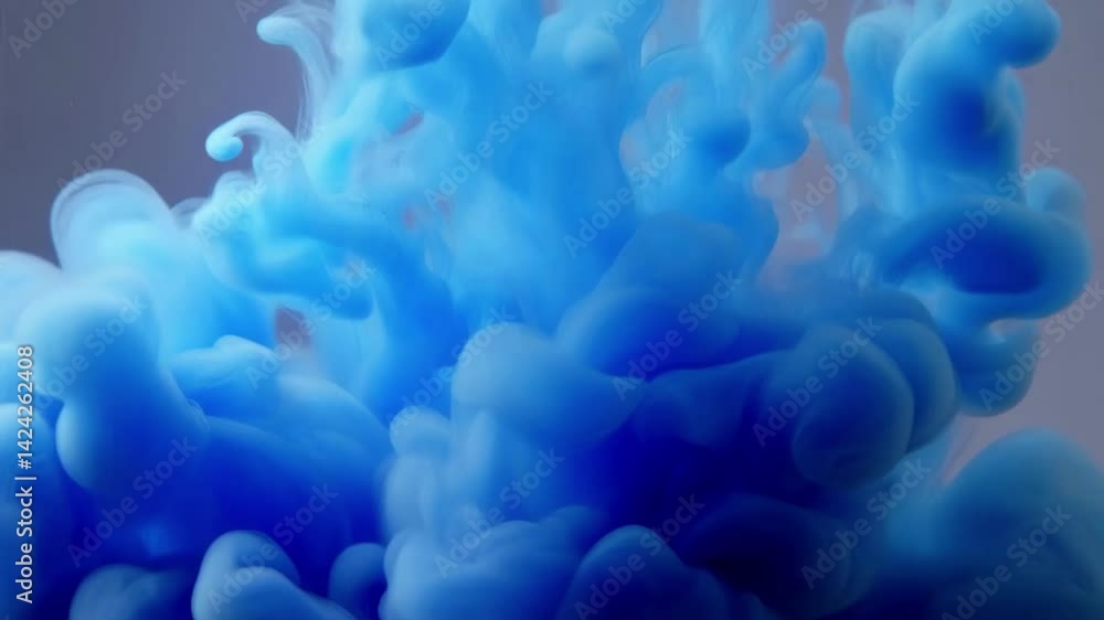Poster dynamic blue ink swirling in water, creating mesmerizing cloud-like formations with soft textures