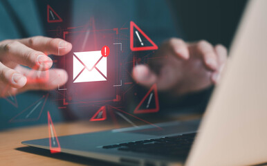 Business man using smartphone and computer that show warning sign after got attack phishing email...
