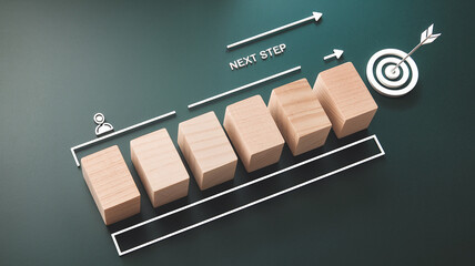Wooden blocks arranged as a growth chart, leading to a target with an arrow, symbolizing progress and achievement.  Concept illustrates steps toward a goal. Free space available.