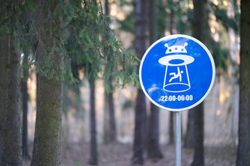 A road sign warning that aliens may land in the park