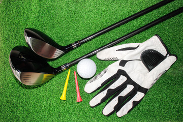 Golf Equipment Display with Clubs, Golf Ball, and Tees on Grass
