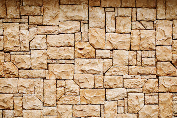 Natural stone wall texture background for use in eco-friendly, sustainable, and environmental design themes. Offers a raw and organic appearance