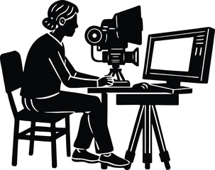silhouette of person editing video on computer