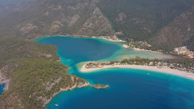 The lagoon of &Ouml;l&uuml;deniz. This unique natural beauty, with its turquoise and navy blue waters, white beaches and lush green mountains, resembles a postcard.