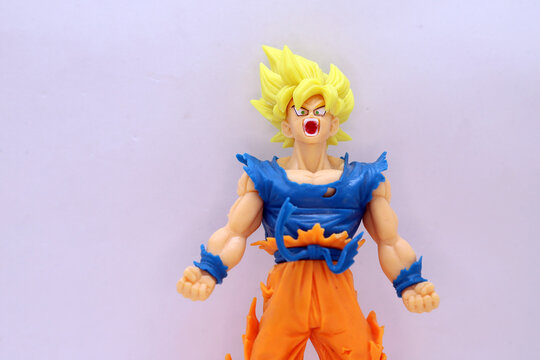 
Closeup of Goku Super Saiyan action figure from the Dragon Ball anime on a white background isolated