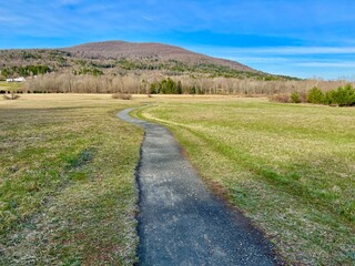 The winding, meandering Windham Path, in early spring. walk, bike, hike or run by meadow, creek, stream enjoying the mountain sunrise. Small town countryside vibe.  Charming ski area in the Catskills.