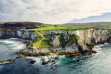 Larrybane Quarry from Above – Aerial View of Northern Ireland’s Dramatic Limestone Cliffs and Clear Calm Sea	