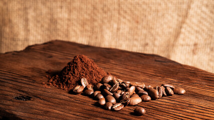 Arabica Coffee Beans Maragogipe on a Wooden Background. Elephant Beans with Ground Coffee