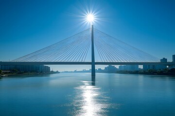 Obraz premium The cable-stayed bridge under the sunshine and the reflection of the city