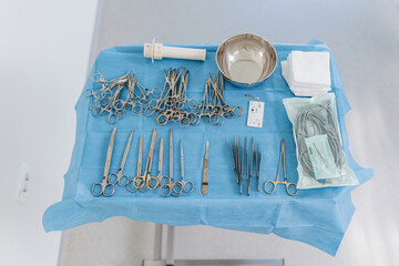 Empty sterile operating veterinary room with surgical instruments and table ready for operation