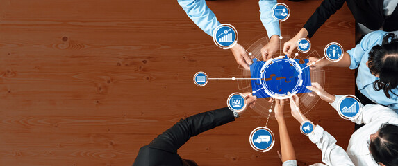 A diverse team collaborates effectively in a business environment, utilizing data visualization and strategic planning to achieve common goals and drive growth. Amity