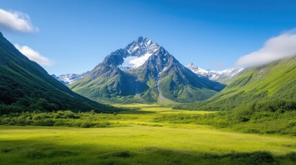 Fototapeta premium Majestic mountain peak overlooking a lush valley. A stunning alpine vista