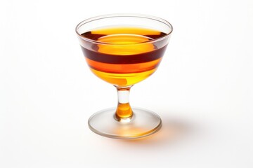 A stylish pour of a deep amber cocktail from a mixing glass into a short glass, garnished