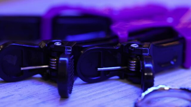  A close-up video showing ornate silver scissors under blue lighting. Suitable for design, craftsmanship, beauty, or barber shop related content. Showcases details and design features.