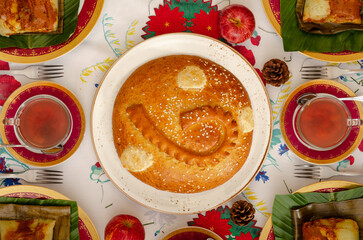 Overhead View of Large Sweet Bread (Mantecado) on Round Plate – Festive Golden Centerpiece