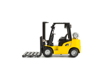 Yellow forklift isolated on white background. Logistics concept. Logistics and supply chain management for online shopping concept. Delivery of goods or products to the store worldwide. Cardboard box.