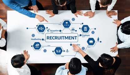 A diverse team collaborates in an office setting, analyzing the recruitment process focused on...