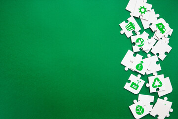 Scattered Sustainability Puzzle Pieces with Green Icons. puzzle pieces featuring various green...